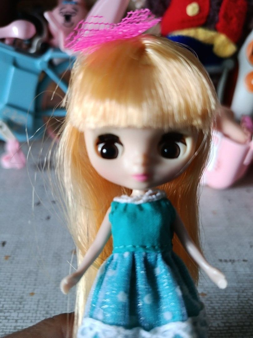 Petite Blythe Doll (Category: Kids Toys) located in General Trias. Submitted by titojay (Listing ID 1444328009, Image 3). Description: Petite Blythe Doll "Enchanted Little Lodge" 2008 - Adorable blonde doll - Blue dress with white polka dots and lace trim - Cute pink bow in hair - Ideal for doll collectors or playtime fun.