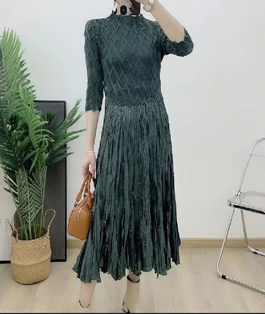 Pleated Midi Dress with Diamond Pattern - Dark Green (Category: Dresses) located in Makati City. Submitted by brooklyn87370 (Listing ID 1444355865, Image 1). Description: - Dark green midi dress - Unique diamond pattern on bodice and sleeves - Beautiful pleated, crinkled skirt texture - Three-quarter length sleeves - High neckline - Flowy silhouette - Versatile: great for dressing up or down.
