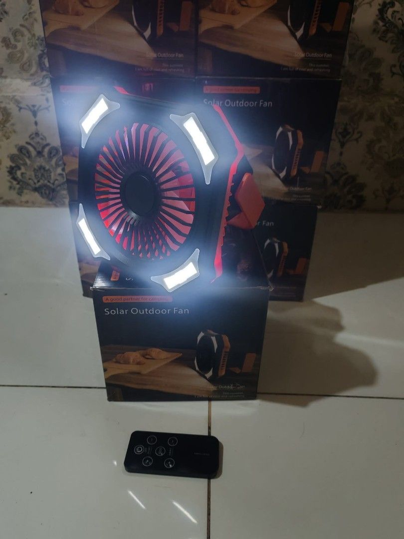 Portable Outdoor Fan with Remote and Light (Category: Fans) located in Manila. Submitted by iamishen (Listing ID 1444347899, Image 2). Description: - Portable solar-powered fan - Ideal for camping and outdoor activities - Built-in light for convenience - Includes remote control - Rechargeable via solar panel or USB - Multiple units available.