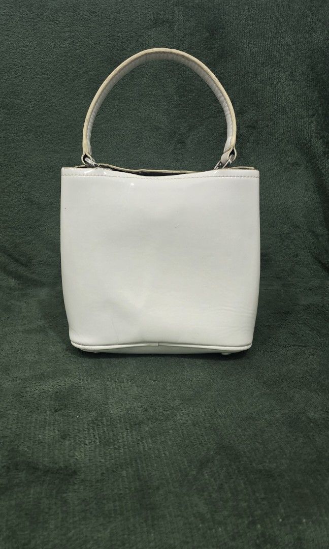 Prada Panier Bucket Bag (Category: Luxury Bags & Wallets) located in Bacoor. Submitted by deux_trading_corporation (Listing ID 1444420933, Image 2). Description: 82k and above on 2ndhand market. condition: Rank AB - has normal signs of wear but no damage whatsoever. needs bags spa. payment first. you can always ask for discount/tawad but no to sobrang barat. no reservation. always check all the photos. some photo/s indicate the flaw..