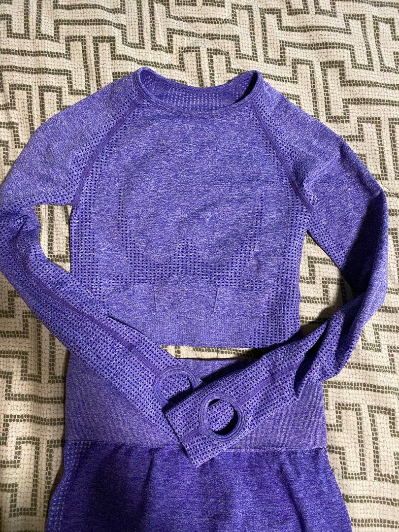 Purple Workout Set - Crop Top & Leggings (Category: Activewear) located in Makati City. Submitted by s_mimi (Listing ID 1444309931, Image 2). Description: - Purple activewear set - Includes long-sleeve crop top with thumbholes - High-waisted leggings - Breathable knit fabric with textured details - Comfortable and stretchy material - Ideal for gym or yoga sessions Free size .
