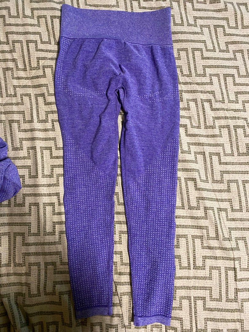 Purple Workout Set - Crop Top & Leggings (Category: Activewear) located in Makati City. Submitted by s_mimi (Listing ID 1444309931, Image 3). Description: - Purple activewear set - Includes long-sleeve crop top with thumbholes - High-waisted leggings - Breathable knit fabric with textured details - Comfortable and stretchy material - Ideal for gym or yoga sessions Free size .