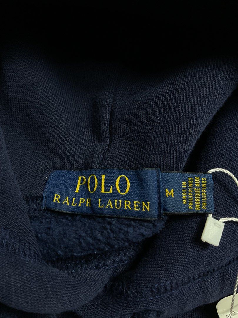 Ralph Lauren Hoodie (Category: Coats, Jackets and Outerwear) located in San Pablo. Submitted by pj_thrifthings (Listing ID 1444430201, Image 3). Description: Polo Ralph Lauren Hoodie This Polo Ralph Lauren hoodie features a navy blue cotton blend body and a varsity-style “P” chenille patch on the chest. Medium on tag Width - 23 Length - 28 Flawless No issues Can do shipping nationwide .