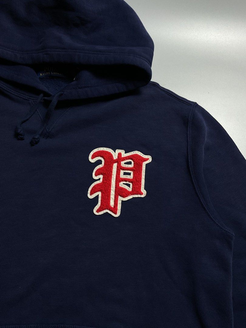 Ralph Lauren Hoodie (Category: Coats, Jackets and Outerwear) located in San Pablo. Submitted by pj_thrifthings (Listing ID 1444430201, Image 2). Description: Polo Ralph Lauren Hoodie This Polo Ralph Lauren hoodie features a navy blue cotton blend body and a varsity-style “P” chenille patch on the chest. Medium on tag Width - 23 Length - 28 Flawless No issues Can do shipping nationwide .