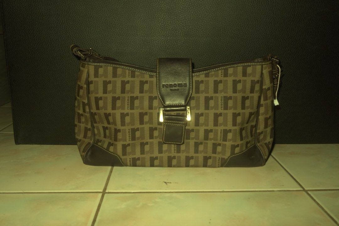 Renoma Paris Monogram Shoulder Bag (Category: Luxury Bags & Wallets) located in Manila. Submitted by noooneeee99 (Listing ID 1444407216, Image 1). Description: - Classic brown shoulder bag with Renoma Paris monogram pattern. - Genuine leather trim and strap. - Zipper closure on the back pocket. - Main compartment with zipper closure and internal pockets. - Interior is clean and well-maintained. - A stylish and practical choice for everyday carry.