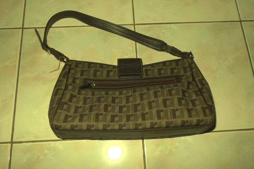Renoma Paris Monogram Shoulder Bag (Category: Luxury Bags & Wallets) located in Manila. Submitted by noooneeee99 (Listing ID 1444407216, Image 2). Description: - Classic brown shoulder bag with Renoma Paris monogram pattern. - Genuine leather trim and strap. - Zipper closure on the back pocket. - Main compartment with zipper closure and internal pockets. - Interior is clean and well-maintained. - A stylish and practical choice for everyday carry.