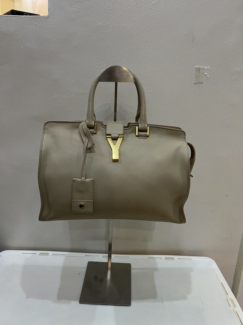 Saint Laurent YSL Cabas (Category: Luxury Bags & Wallets) located in Manila. Submitted by gailmg (Listing ID 1444349130, Image 2). Description: - Authentic Saint Laurent bag with cert - Color: Beige leather - Hardware: Gold - Iconic YSL logo on front - Interior zip pocket - Includes leather tag - Versatile for daily use or special occasions - A timeless classic.