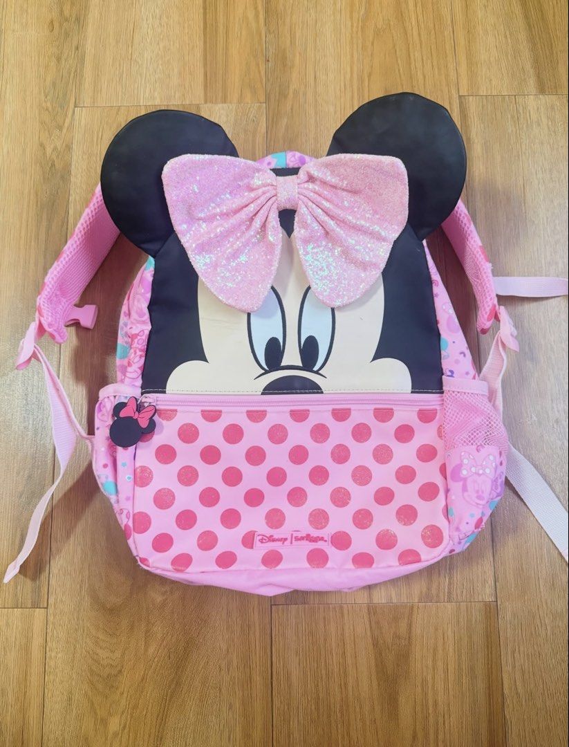 Smiggle Minnie Mouse Sequin Bow Junior Backpack (Category: Babies & Kids Fashion) located in Catbalogan. Submitted by declutterfind (Listing ID 1444307588, Image 1). Description: - Adorable Minnie Mouse design - Features a large pink sequin bow - Fun pink polka dot pattern - Adjustable straps for a comfortable fit - Ideal for school, day trips, or any Minnie Mouse fan.