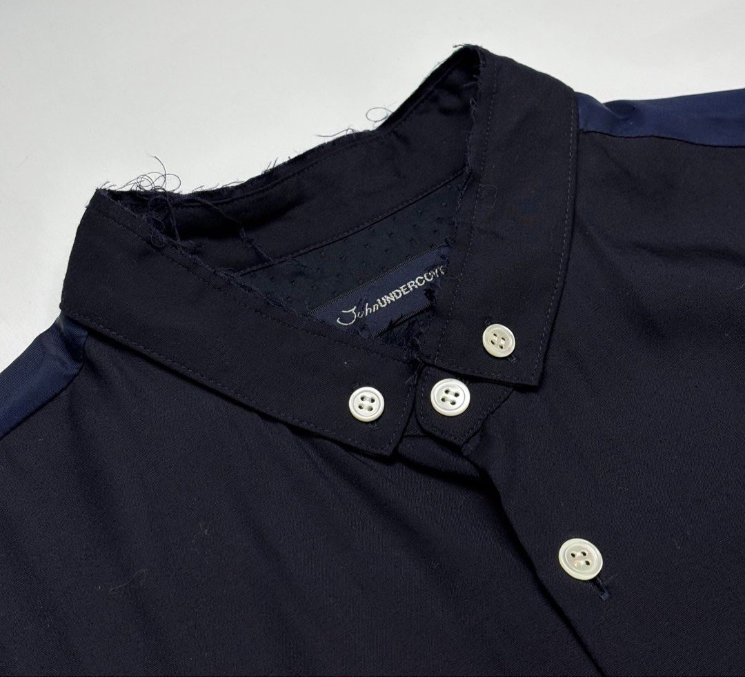 S/S17 John Undercover Two Tone Long Shirt (Category: Coats, Jackets and Outerwear) located in Cavite. Submitted by sc_rcity (Listing ID 1444452274, Image 3). Description: Tagged Size : 2 JP | Medium Men’s Authentic Like New No Flaw Made in Japan No Inclusion A panelled, color-blocked tunic-length construction featuring black, navy, and dark blue tones.Includes a clean band collar, a single welted chest pocket, and lower horizontal welt pockets bu