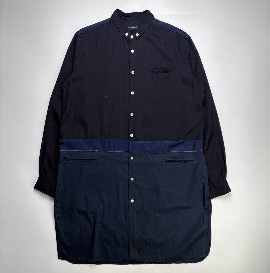 S/S17 John Undercover Two Tone Long Shirt (Category: Coats, Jackets and Outerwear) located in Cavite. Submitted by sc_rcity (Listing ID 1444452274, Image 1). Description: Tagged Size : 2 JP | Medium Men’s Authentic Like New No Flaw Made in Japan No Inclusion A panelled, color-blocked tunic-length construction featuring black, navy, and dark blue tones.Includes a clean band collar, a single welted chest pocket, and lower horizontal welt pockets bu