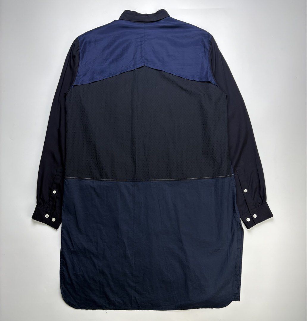 S/S17 John Undercover Two Tone Long Shirt (Category: Coats, Jackets and Outerwear) located in Cavite. Submitted by sc_rcity (Listing ID 1444452274, Image 2). Description: Tagged Size : 2 JP | Medium Men’s Authentic Like New No Flaw Made in Japan No Inclusion A panelled, color-blocked tunic-length construction featuring black, navy, and dark blue tones.Includes a clean band collar, a single welted chest pocket, and lower horizontal welt pockets bu