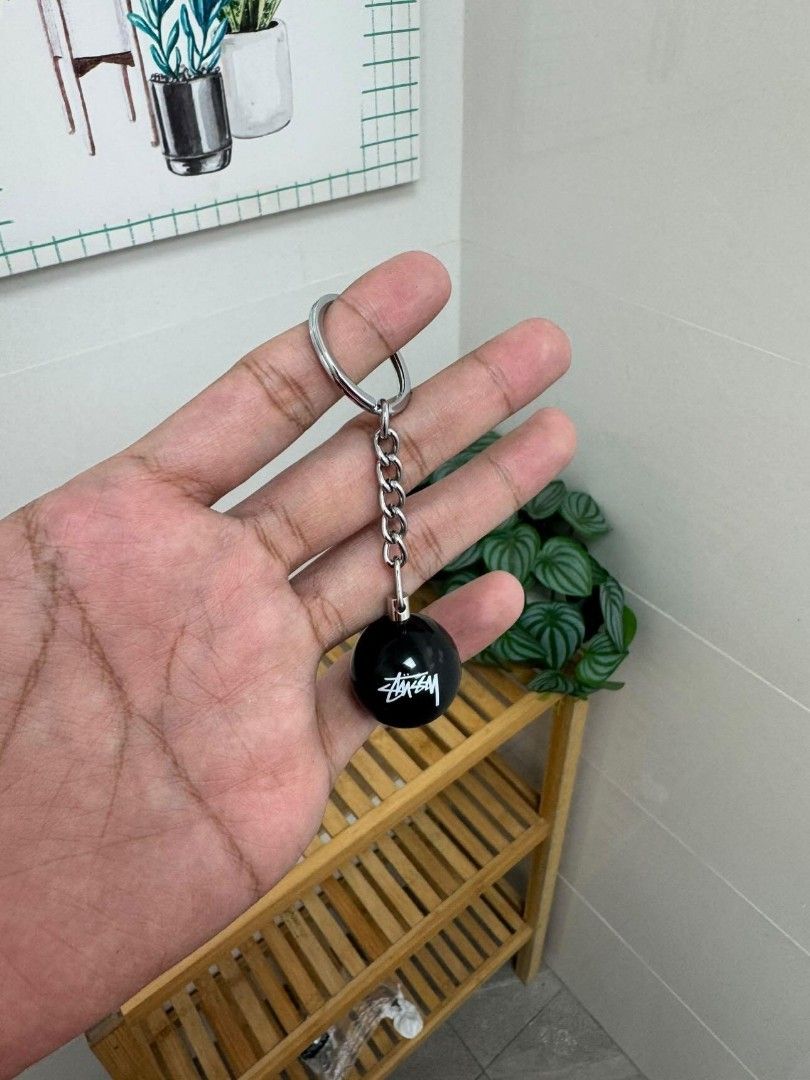 Stussy 8 Ball Keychain (Category: Luxury Accessories) located in Caloocan City. Submitted by ankng_mdr (Listing ID 1444495760, Image 3). Description: - Iconic Stussy 8-ball design - Durable metal chain and ring - Perfect accessory for keys or bags - Adds a stylish touch to your belongings.