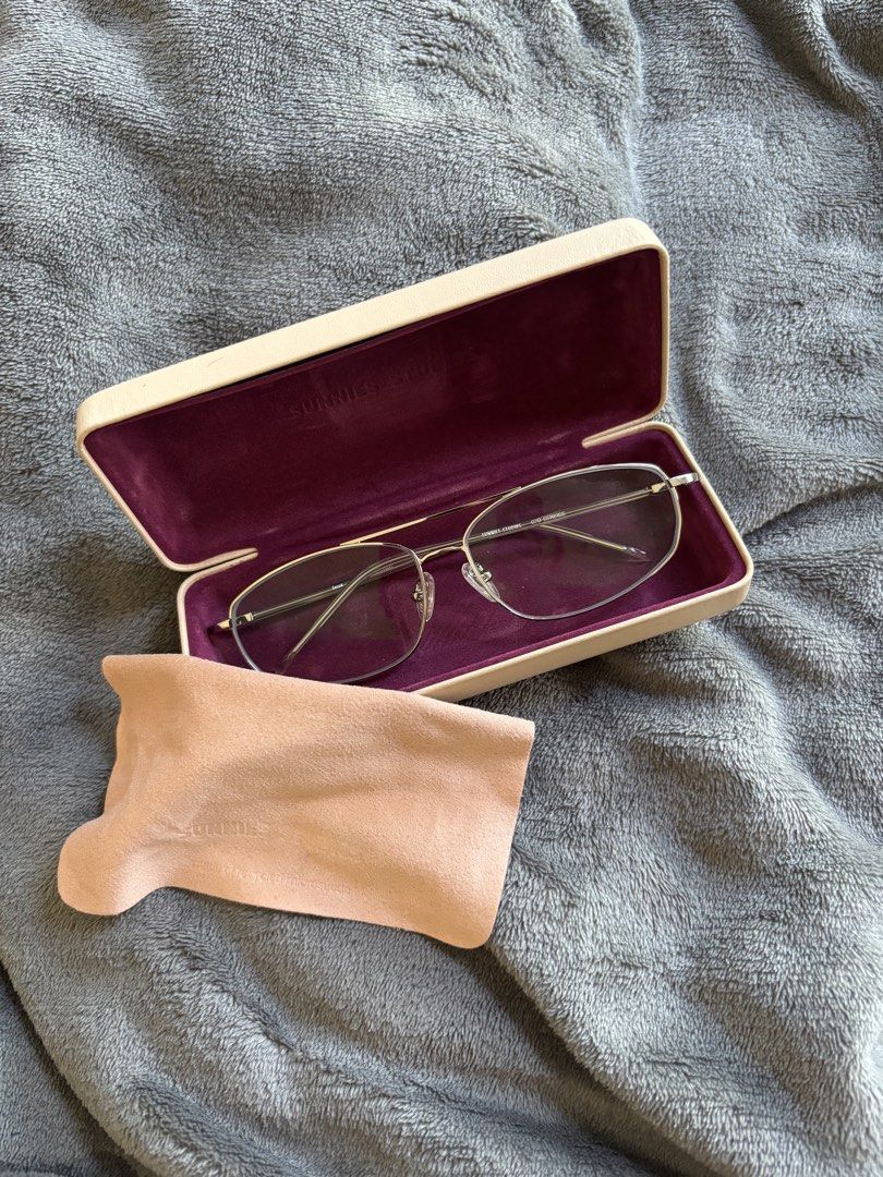 SUNNIES STUDIOS G70 SST1B1SS Eyeglasses with Case (Category: Sunglasses & Eyewear) located in Manila. Submitted by michaela17_ (Listing ID 1444339642, Image 1). Description: Sunnies Studios eyeglasses (Model G70 SST1B1SS). Silver metal frame, clear lenses. Includes original case & cloth. With 25/25 grade & only used once .