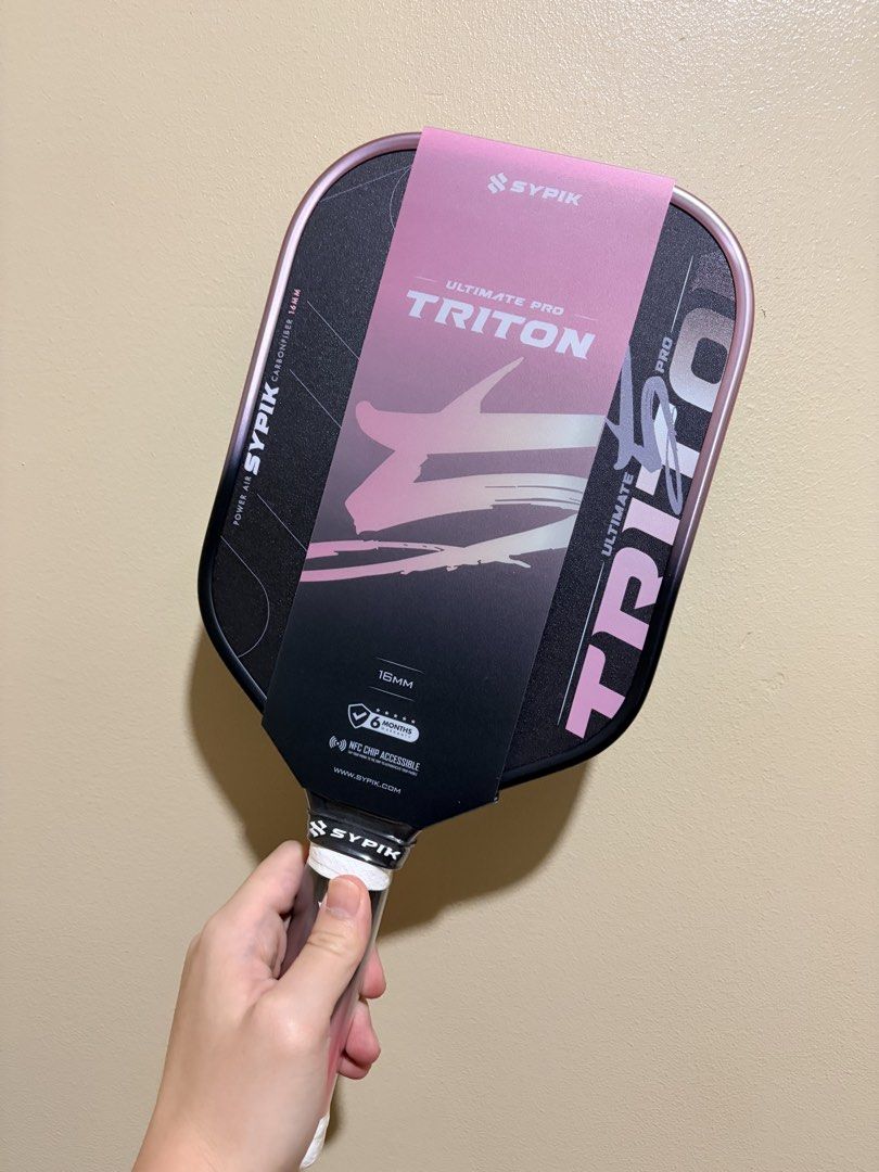 Sypik Triton Pro 5 (Pickleball Paddle) (Category: Racket and Ball Sports) located in Manila. Submitted by dinkrpaddlelab (Listing ID 1444403433, Image 3). Description: For Sale Sypik Triton Pro 5 (Brand New) ON HAND Last 2 pcs available Colors available: • Rise Pink • Chill Mint (SOLD) • Aura Gold 👉🏻 Elongated 👉🏻 16 mm Price: ₱9,300 Comes with: * Free paddle cover * Clear edge tape * Over grip (1 pc) Location: Pasay/Marikina/Manila/Makati.