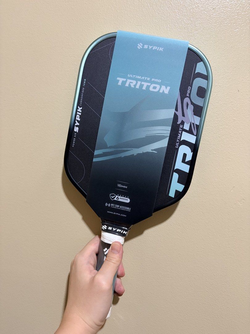 Sypik Triton Pro 5 (Pickleball Paddle) (Category: Racket and Ball Sports) located in Manila. Submitted by dinkrpaddlelab (Listing ID 1444403433, Image 2). Description: For Sale Sypik Triton Pro 5 (Brand New) ON HAND Last 2 pcs available Colors available: • Rise Pink • Chill Mint (SOLD) • Aura Gold 👉🏻 Elongated 👉🏻 16 mm Price: ₱9,300 Comes with: * Free paddle cover * Clear edge tape * Over grip (1 pc) Location: Pasay/Marikina/Manila/Makati.