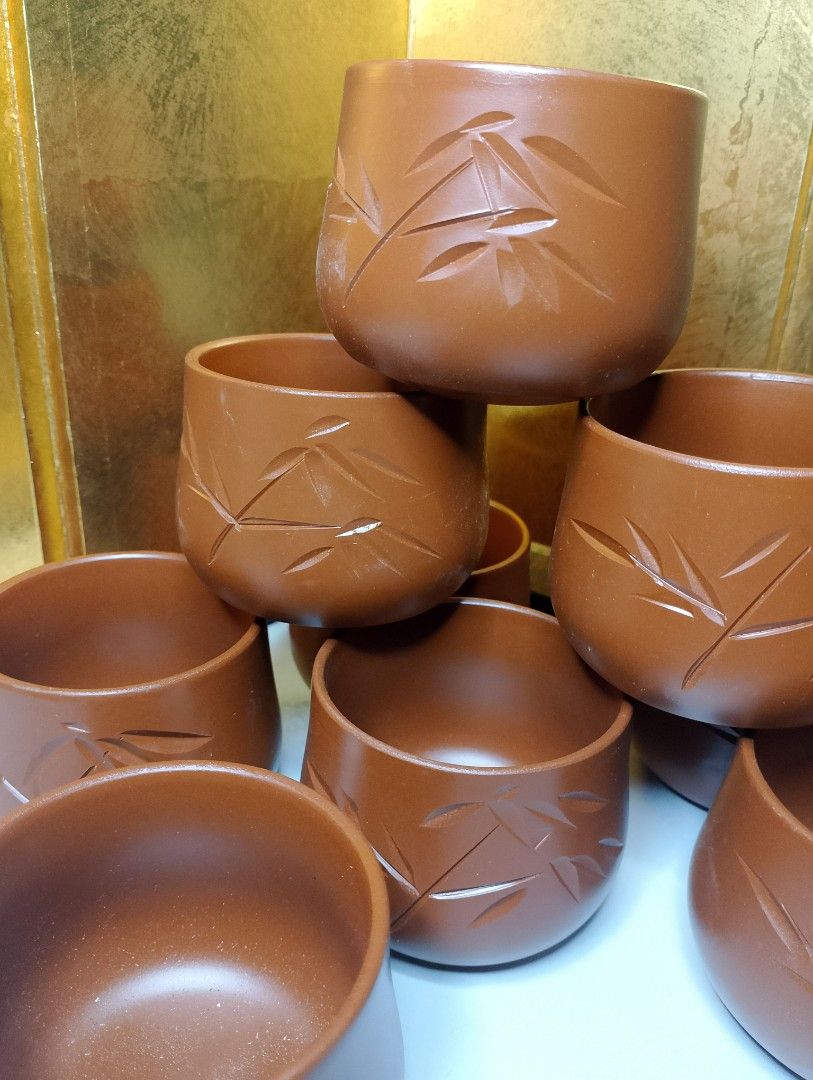 Terracotta Tea Cups with Bamboo Design (Category: Coffee & Tea Tableware) located in Valenzuela. Submitted by buylaaaaa (Listing ID 1444450042, Image 2). Description: - Set of 9 brown tea cups - Features a beautiful carved bamboo leaf design - Ideal size for tea or sake - Warm, earthy brown color - Perfect for serving guests or personal use - Stacks neatly for convenient storage - Feel free to ask any questions!.