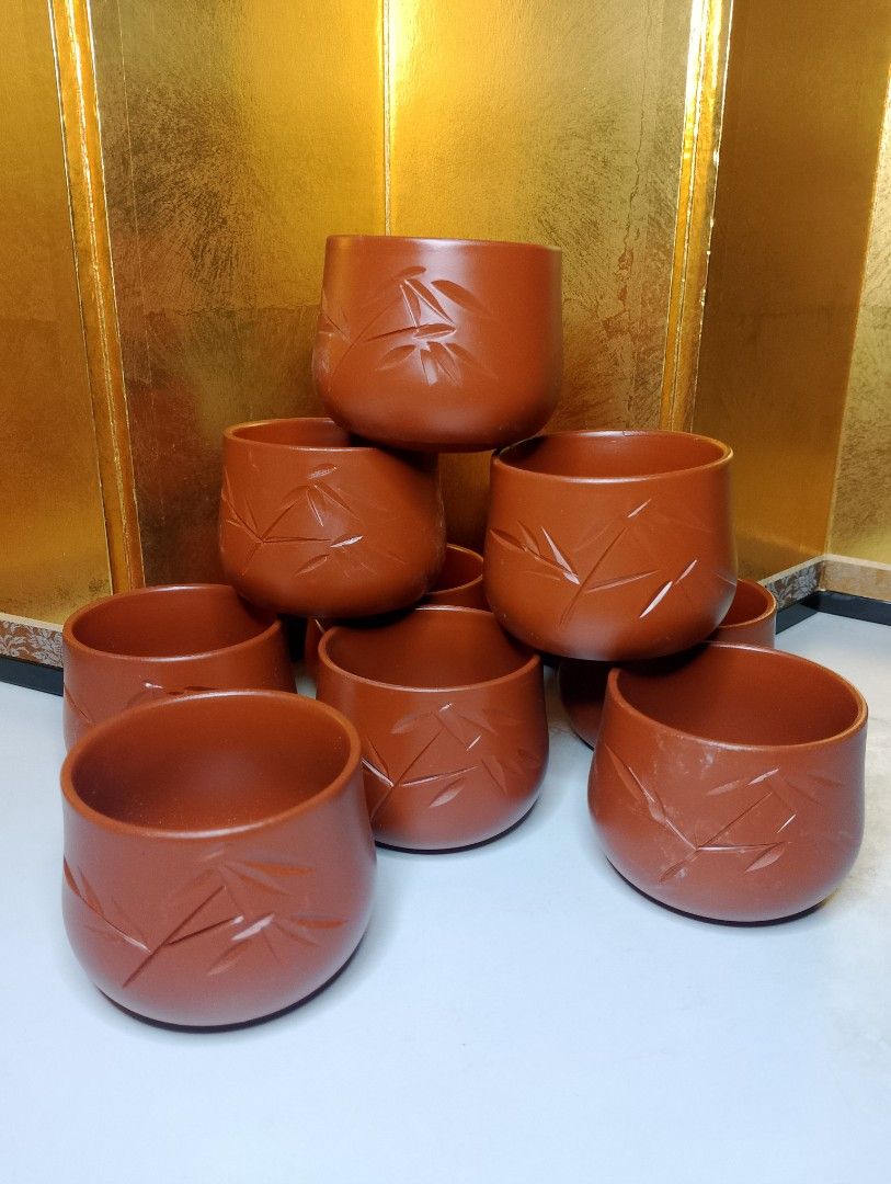 Terracotta Tea Cups with Bamboo Design (Category: Coffee & Tea Tableware) located in Valenzuela. Submitted by buylaaaaa (Listing ID 1444450042, Image 1). Description: - Set of 9 brown tea cups - Features a beautiful carved bamboo leaf design - Ideal size for tea or sake - Warm, earthy brown color - Perfect for serving guests or personal use - Stacks neatly for convenient storage - Feel free to ask any questions!.