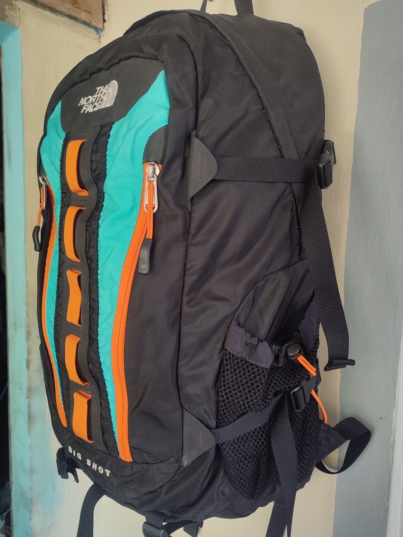 The North Face Big Shot Backpack (Category: Backpacks) located in Lipa City. Submitted by gudoys_outdoor16 (Listing ID 1444362927, Image 3). Description: - The North Face Big Shot backpack - Color: Black with teal and orange accents - Features multiple pockets and straps for storage and support - Ideal for hiking or everyday use - Spacious interior Size 33 Liters 3500 Free Shipping.