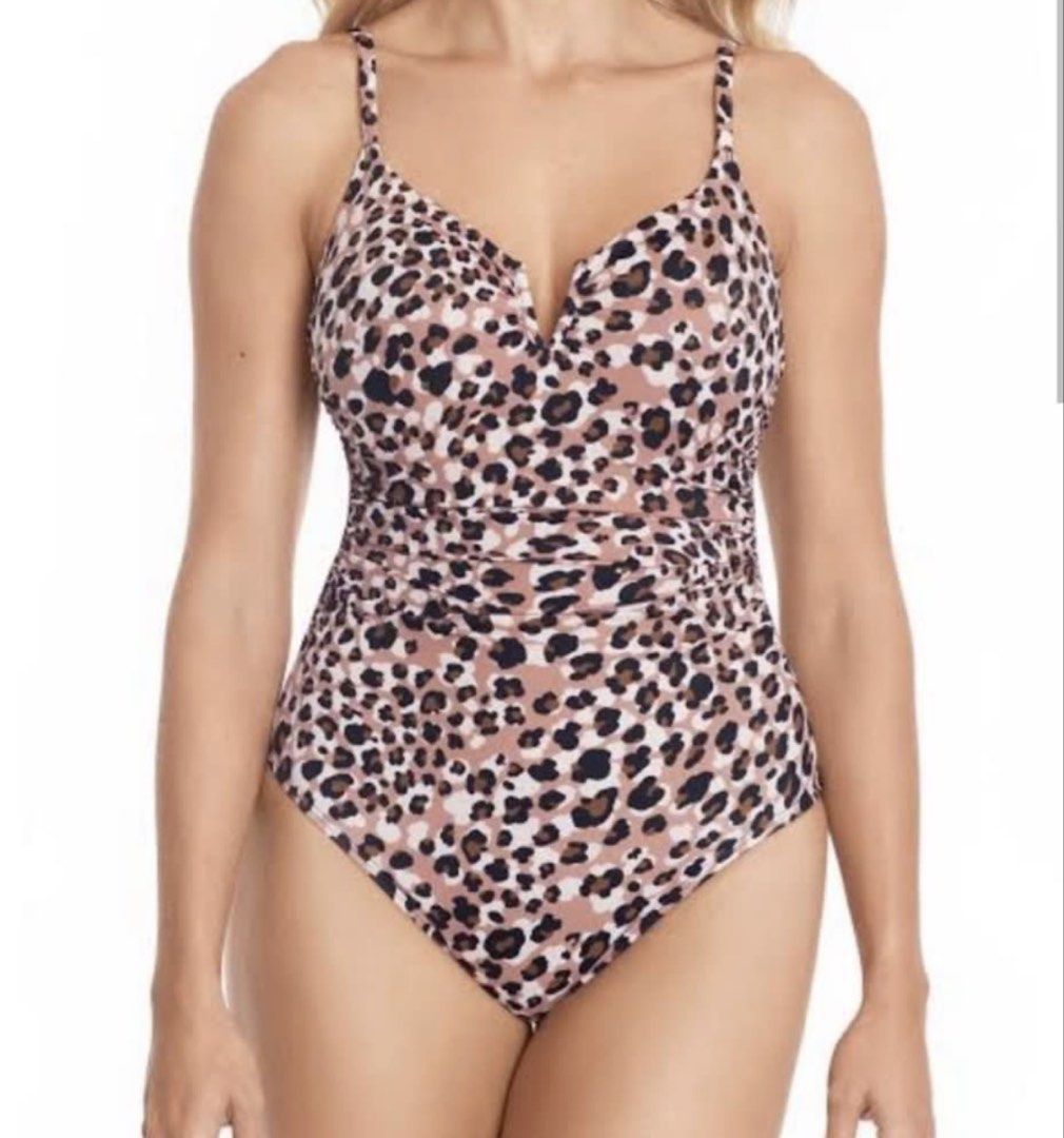 TIME and TRU Leopard Print One-Piece Swimsuit (Category: Bikinis & Swimsuits) located in Pasig City. Submitted by aiyee18 (Listing ID 1444357720, Image 1). Description: * Style: One-piece swimsuit * Print: Classic leopard/animal print in shades of blush pink, beige, brown, and black * Neckline: Deep V-neck with a small notch detail at the center front for an elegant touch * Straps: Adjustable spaghetti straps for a customizable fit * Waist Detail