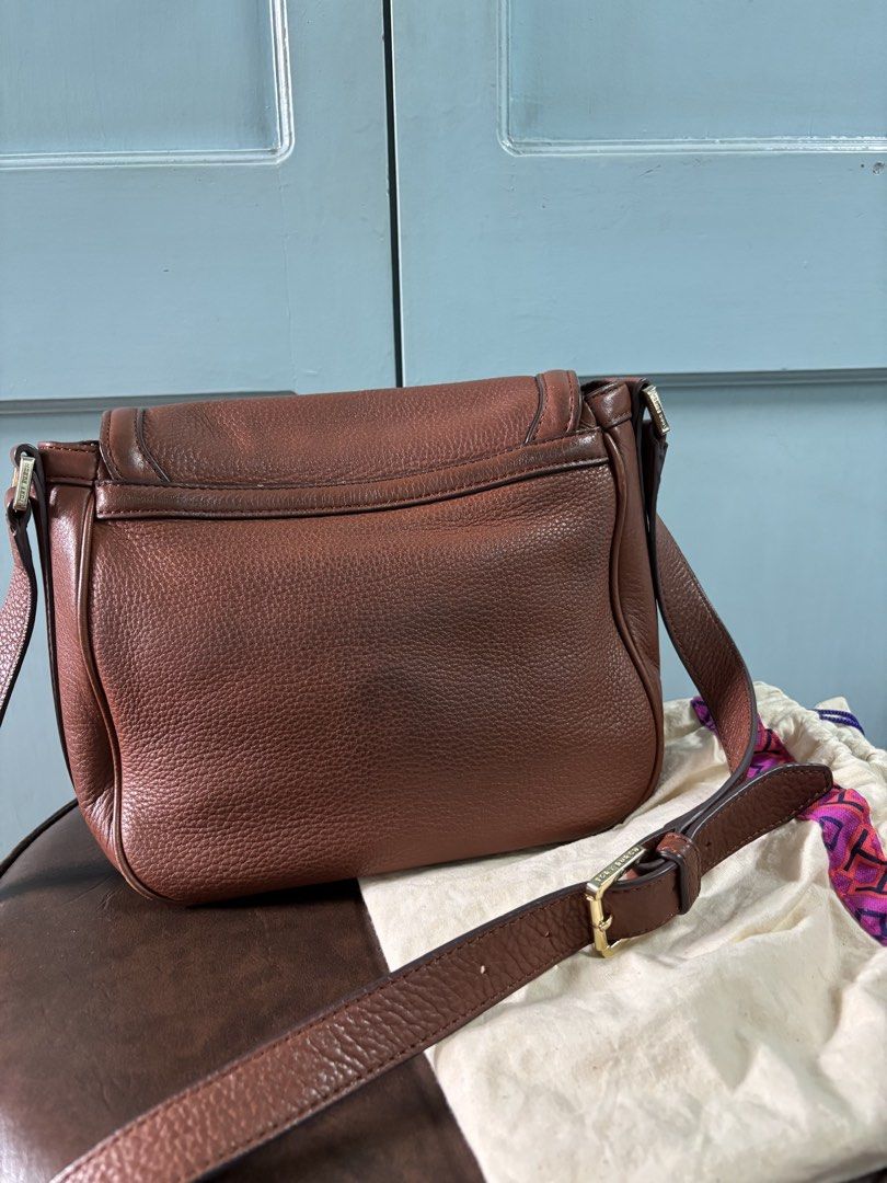 Tory Burch Amanda Brown Cross Body Bag (Category: Luxury Bags & Wallets) located in Manila. Submitted by mwhimsy (Listing ID 1444394160, Image 3). Description: - Brand: Tory Burch - Material: Genuine Brown pebbled leather - Design: Iconic gold double T logo on front flap - Interior: Patterned lining - Strap: Adjustable shoulder strap - Includes: Original dust bag - Ideal for: Everyday use - Authentic Tory Burch. Pre-loved.