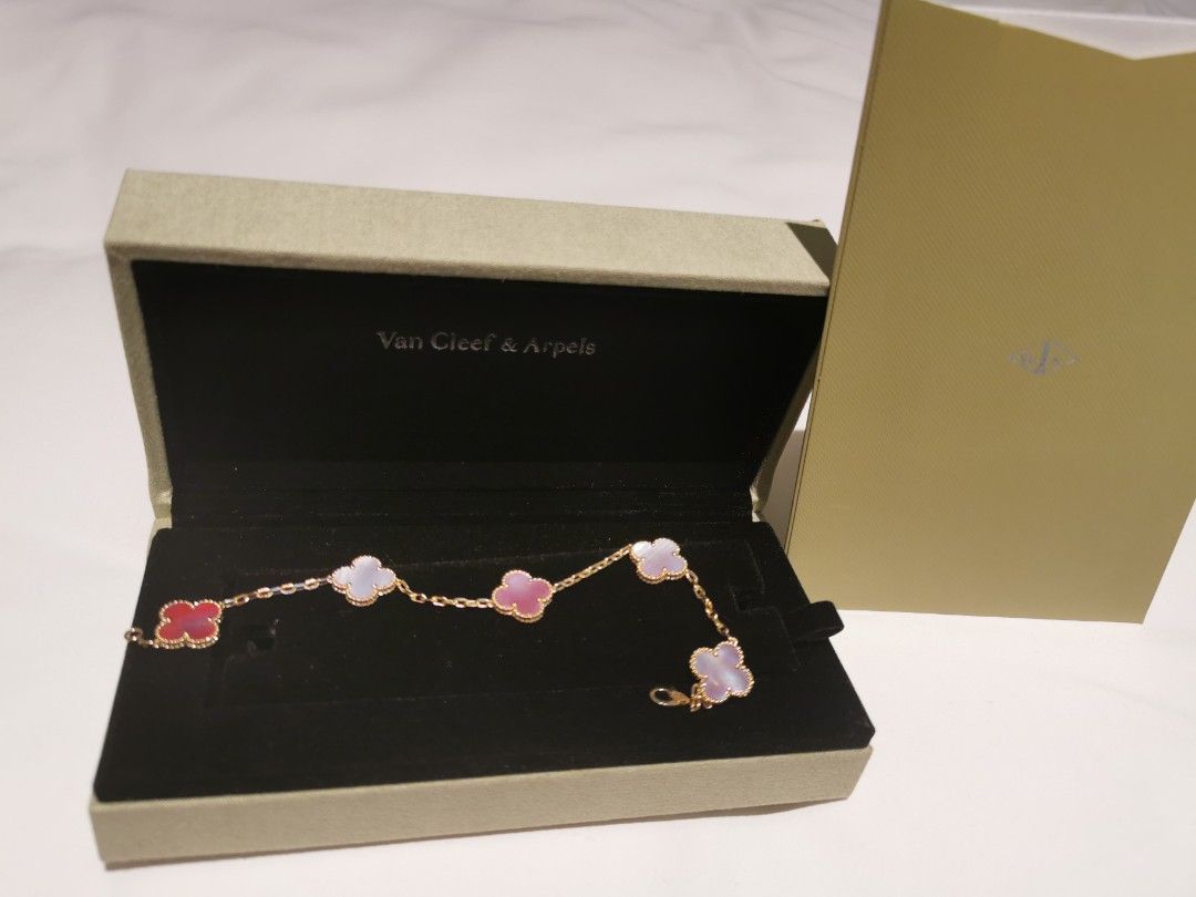 Van Cleef & Arpels Sweet Alhambra Bracelet (Category: Bracelets) located in Manila. Submitted by kikaylux (Listing ID 1444472335, Image 1). Description: - exact copy Van Cleef & Arpels Sweet Alhambra bracelet - Features 5 clover motifs - Motifs: Pink Mother-of-pearl - Chain: yellow gold - Includes box and certificate - Beautiful, authentic piece 18k real gold.