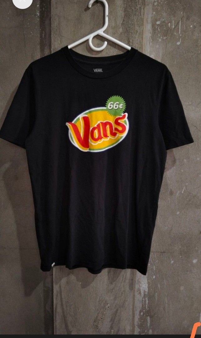 Vans "66¢" Graphic T-Shirt (Category: Tshirts & Polo Shirts ) located in Consolacion. Submitted by keendog.8c27ce (Listing ID 1444419438, Image 2). Description: - Classic black Vans t-shirt - Features the bold "66¢" graphic logo on the front - Made from comfortable, breathable cotton - Short sleeves for a casual look - Ideal for everyday wear and streetwear - Detailed photos available to showcase the graphic - Measurements provided in the photos 