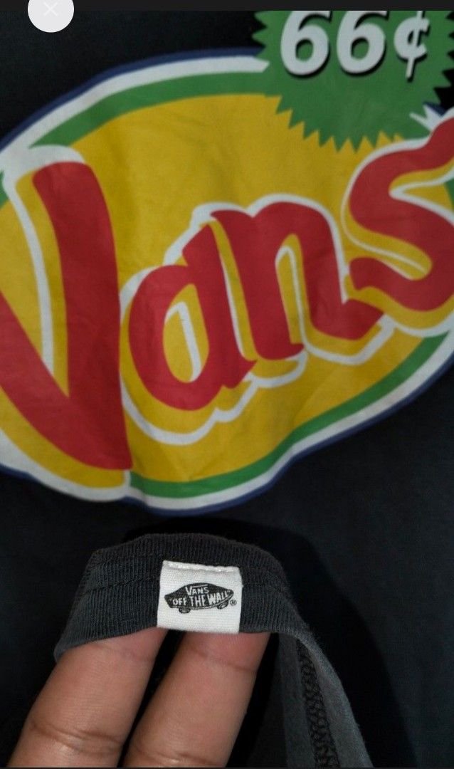 Vans "66¢" Graphic T-Shirt (Category: Tshirts & Polo Shirts ) located in Consolacion. Submitted by keendog.8c27ce (Listing ID 1444419438, Image 3). Description: - Classic black Vans t-shirt - Features the bold "66¢" graphic logo on the front - Made from comfortable, breathable cotton - Short sleeves for a casual look - Ideal for everyday wear and streetwear - Detailed photos available to showcase the graphic - Measurements provided in the photos 