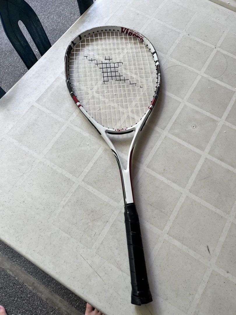 Vigors Tennis Racket AFFORDABLE (Category: Racket and Ball Sports) located in Quezon City. Submitted by nanithefawk (Listing ID 1444320538, Image 2). Description: - Vigors tennis racket - Color: White with red and black accents - Grip: Black - Condition: Some scuff marks on the frame, strings are intact - Ideal for: Casual play and beginners - rfs: barely used .
