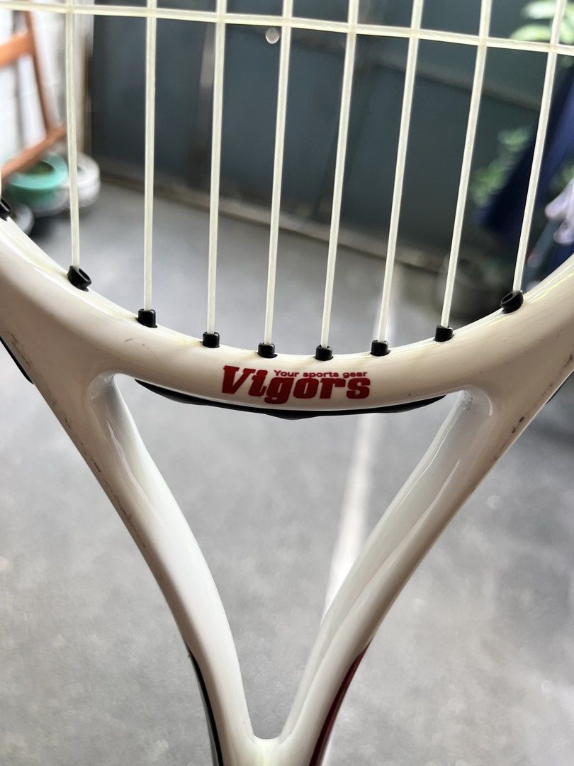 Vigors Tennis Racket AFFORDABLE (Category: Racket and Ball Sports) located in Quezon City. Submitted by nanithefawk (Listing ID 1444320538, Image 3). Description: - Vigors tennis racket - Color: White with red and black accents - Grip: Black - Condition: Some scuff marks on the frame, strings are intact - Ideal for: Casual play and beginners - rfs: barely used .
