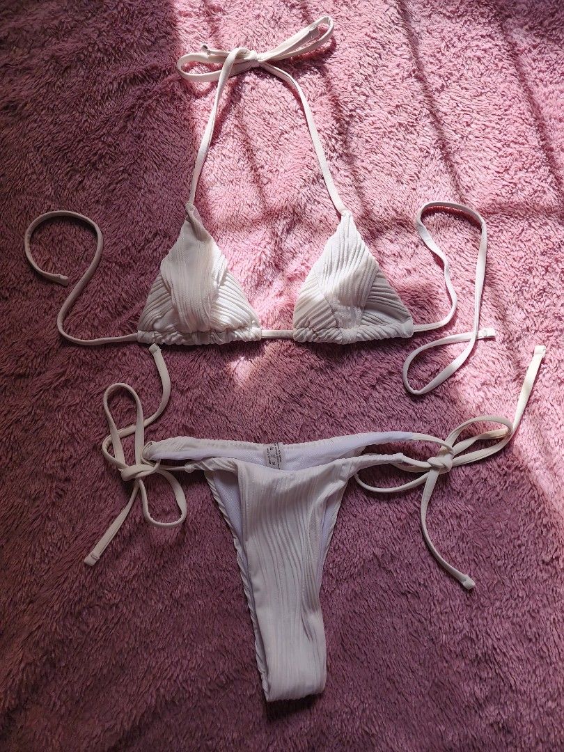 White 2-piece Bikini Set Size S (fits XS) (Category: Bikinis & Swimsuits) located in Trece Martires City. Submitted by lovedbydanie (Listing ID 1444323298, Image 2). Description: - Classic white 2-piece bikini - Adjustable ties at neck and sides - Tagged size S, best fits XS - Ideal for beach trips and pool parties.