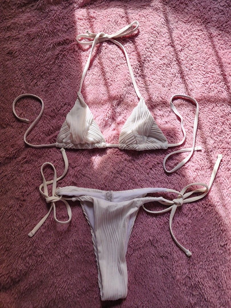 White 2-piece Bikini Set Size S (fits XS) (Category: Bikinis & Swimsuits) located in Trece Martires City. Submitted by lovedbydanie (Listing ID 1444323298, Image 3). Description: - Classic white 2-piece bikini - Adjustable ties at neck and sides - Tagged size S, best fits XS - Ideal for beach trips and pool parties.
