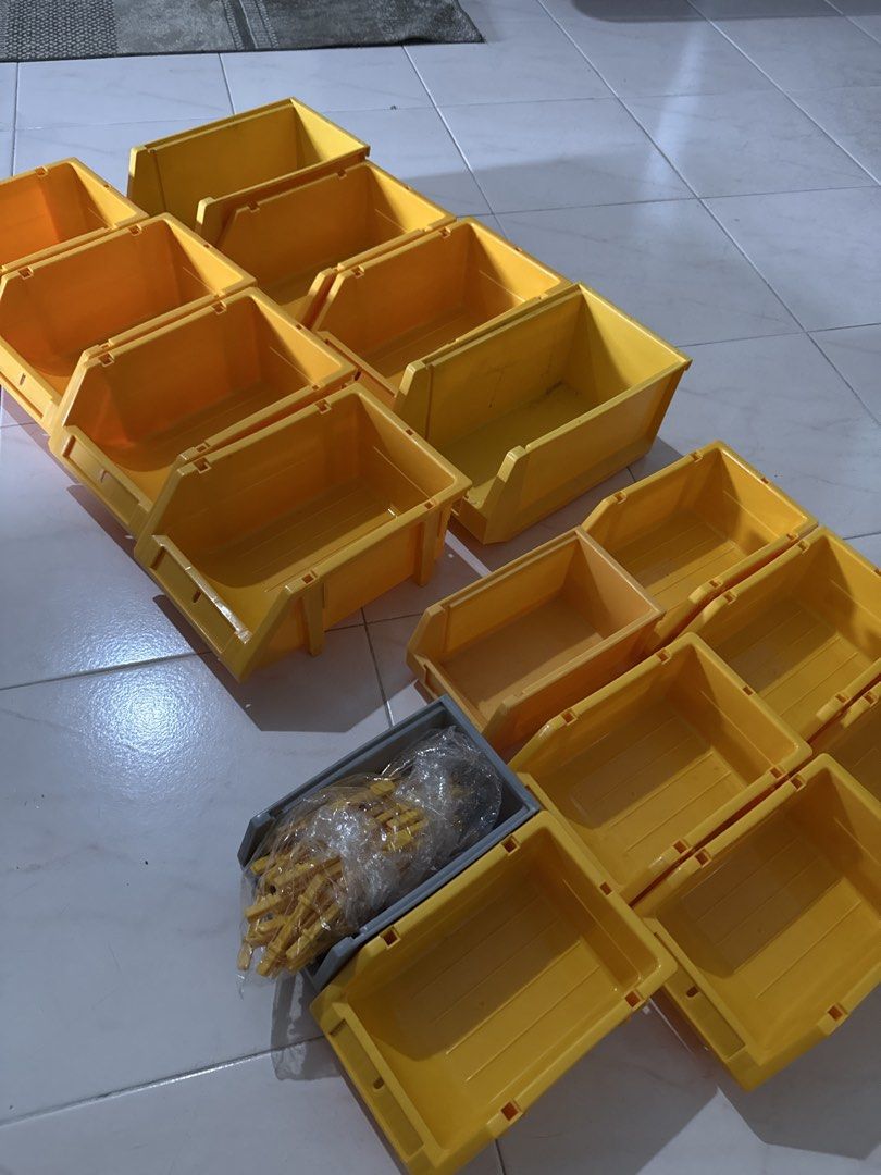 Yellow Stackable Storage (Category: Storage Boxes & Baskets) located in Singapore. Submitted by catmanduu (Listing ID 1444344306, Image 2). Description: - Set of 15 yellow stackable storage bins - Perfect for organizing small items, tools, craft supplies, etc. - Stackable design for efficient storage - Great for workshops, garages, and home organization Dimensions: Small: L19 x W12 x H8.5cm Medium: L24 x W15.5 x H10.5cm.