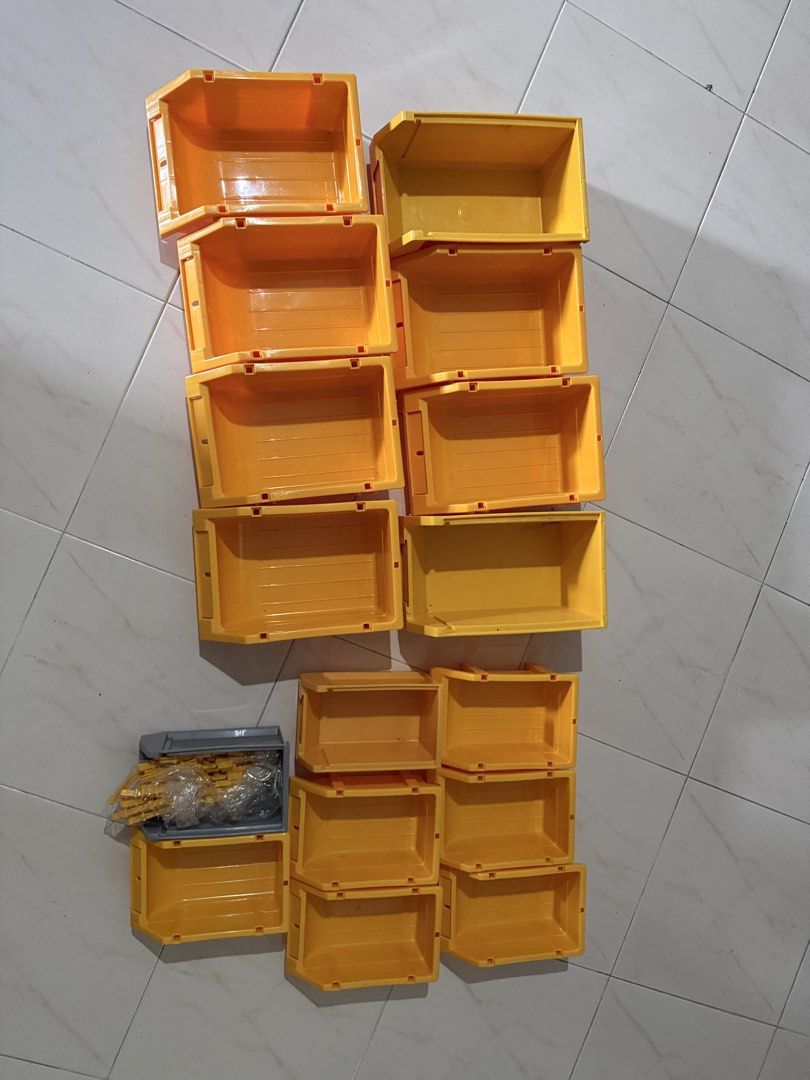 Yellow Stackable Storage (Category: Storage Boxes & Baskets) located in Singapore. Submitted by catmanduu (Listing ID 1444344306, Image 1). Description: - Set of 15 yellow stackable storage bins - Perfect for organizing small items, tools, craft supplies, etc. - Stackable design for efficient storage - Great for workshops, garages, and home organization Dimensions: Small: L19 x W12 x H8.5cm Medium: L24 x W15.5 x H10.5cm.