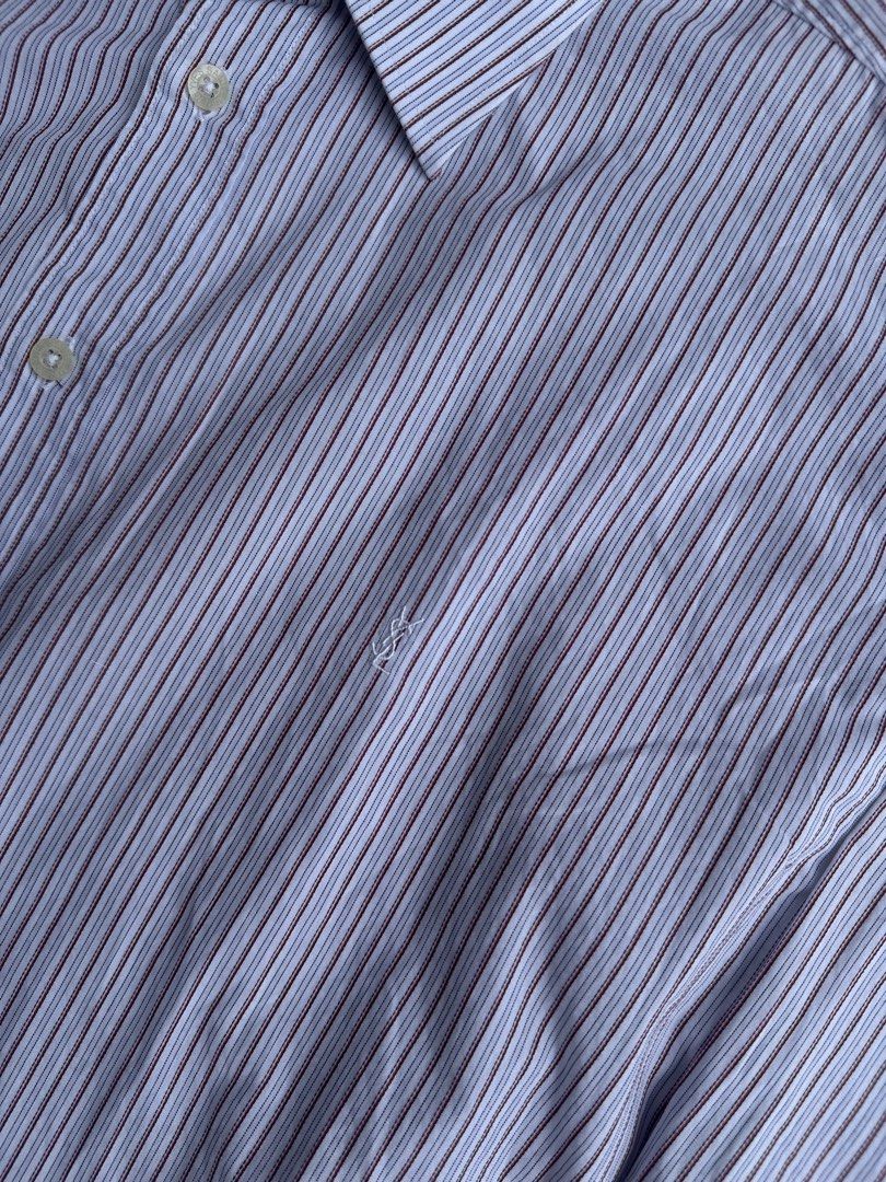 Yves Saint Laurent Men's (Category: Luxury Apparel) located in Davao. Submitted by kurttyyo (Listing ID 1444389173, Image 3). Description: - Classic Yves Saint Laurent dress shirt - Fine blue and maroon pinstripes on white - 100% cotton for ultimate comfort - Long sleeves with button cuffs - Button-down front - Small embroidered YSL logo on chest - Ideal for formal events or smart-casual styling YSL XL | 27.5 x 31f 32b Excellent 1,200.
