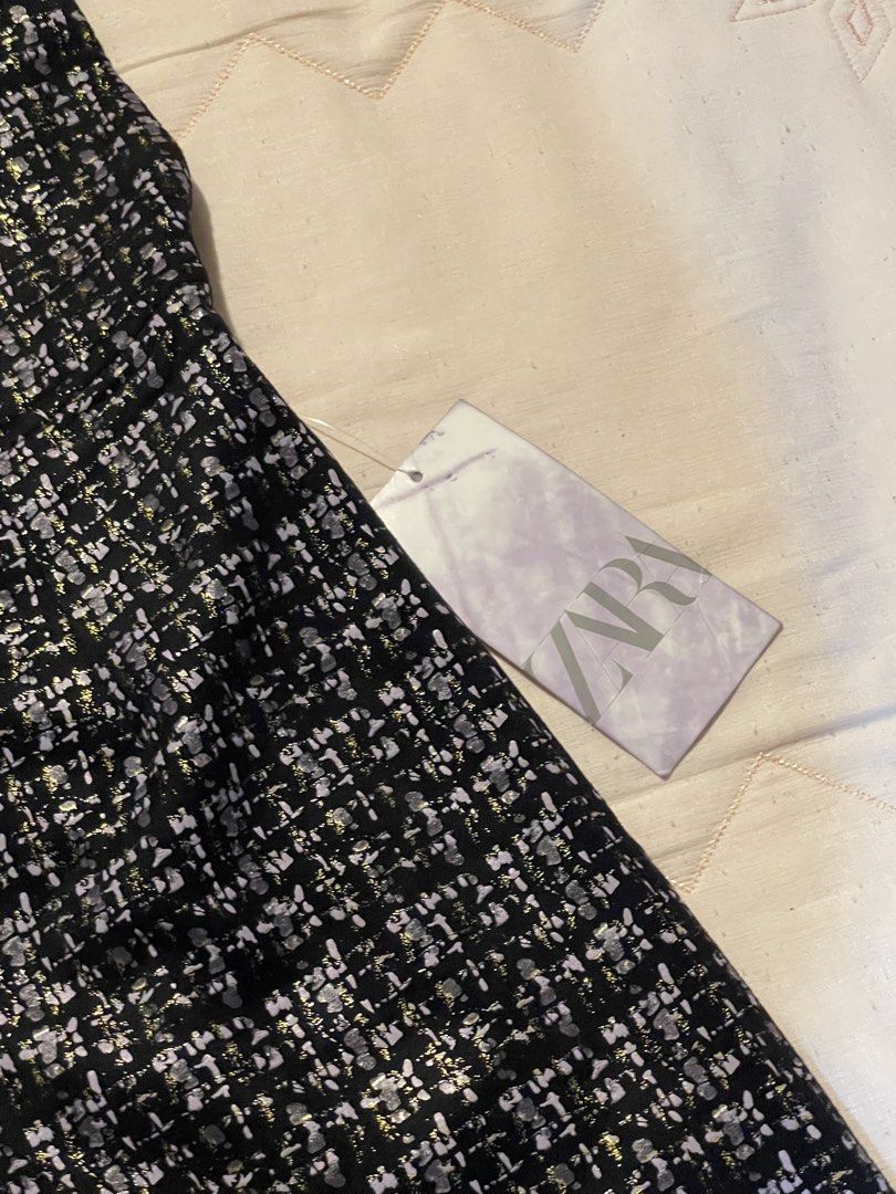 Zara Tweed Double-Breasted Mini Dress (Category: Dresses) located in Manila. Submitted by stargirl05 (Listing ID 1444420450, Image 2). Description: - Zara dress - Tweed-like fabric - Black and white pattern with metallic thread accents - V-neckline - Double-breasted button detail - Sleeveless - Versatile for dressing up or down - Retails for 2800.