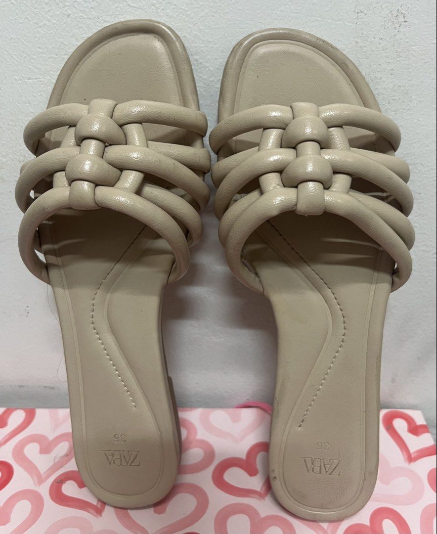 ZARA Woven Strap Flat Sandals Beige Size 36 (Category: Flats & Sandals) located in Manila. Submitted by kittycat_preloved (Listing ID 1444374696, Image 1). Description: - Brand: ZARA - Type: Flat Sandals - Color: Beige - Design: Woven strap across the front - Style: Easy slip-on - Size: 36 - Perfect for: Casual outings, running errands - Condition: Please check photos for details.