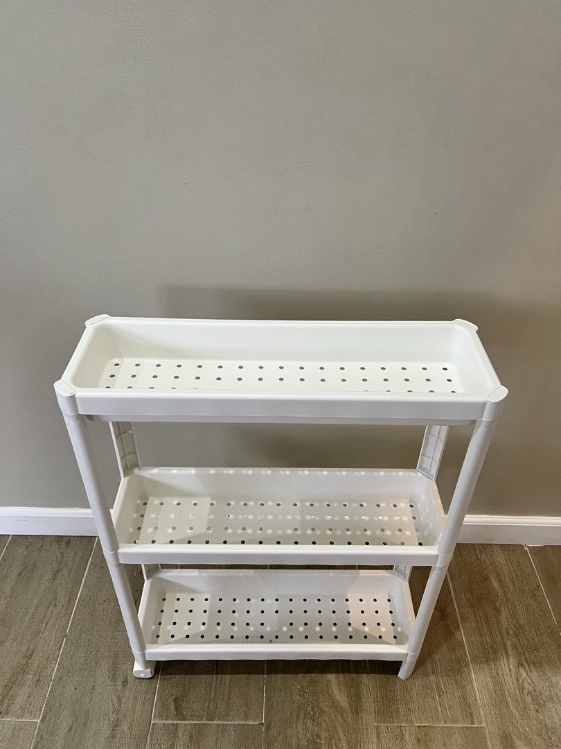 3-Tier Trolley Cart Slim Rack, White (Category: Storage Boxes & Baskets) located in Bacoor. Submitted by mariiiaph (Listing ID 1444658563, Image 2). Description: 3-Tier Trolley Cart Slim Rack on wheels storage, White Brand: Ikea This slim, 3-tier rolling cart is perfect for small spaces like bathrooms, kitchens, laundry areas, or even offices. white design adds a modern touch, while the open shelves make it easy to see and grab what you need. Lig