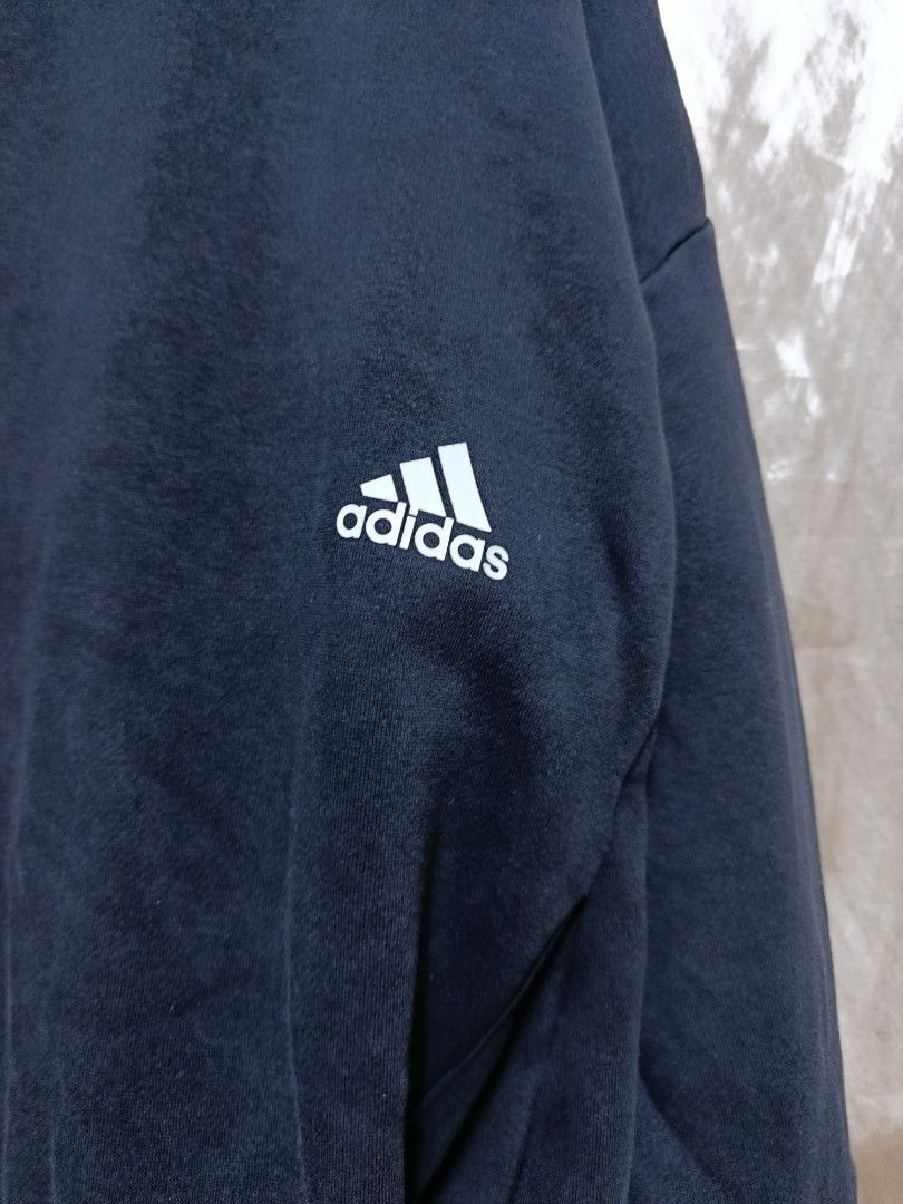 Adidas "Three Stripes" Crewneck Sweatshirt (Category: Coats, Jackets and Outerwear) located in Jasaan. Submitted by eliwhomp (Listing ID 1444624327, Image 3). Description: - Classic black Adidas crewneck sweatshirt - Features the iconic "Three Stripes" graphic band across the chest - Includes the classic Adidas logo on the left chest - Made from a comfortable cotton blend - Ideal for casual wear and everyday styling - 25 × 29.