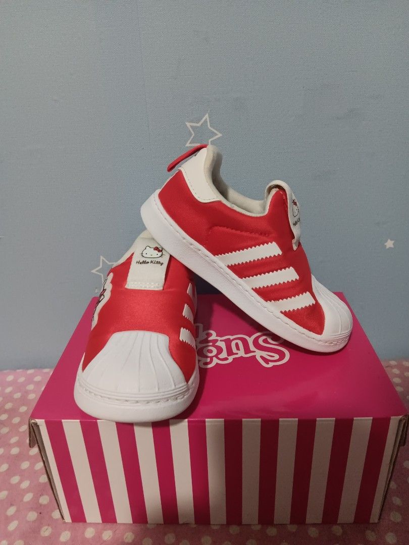 Adidas x Hello Kitty Superstar 360 Shoes (Category: Babies & Kids Fashion) located in Valenzuela. Submitted by hailiesminicloset (Listing ID 1444632528, Image 2). Description: - Adorable red Adidas Superstar 360 shoes - Features a cute Kitty design - Easy slip-on style for kids - Iconic Adidas three stripes and shell toe - Ideal for Kitty enthusiasts - Includes original box.