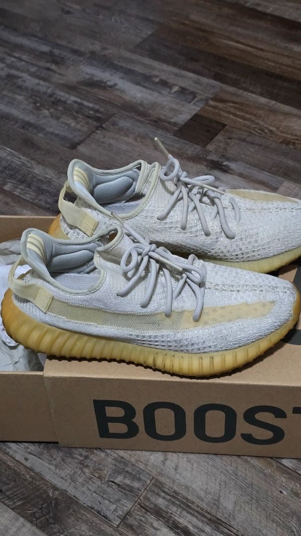 Adidas Yeezy Boost 350 V2 Cream White (+ $10 For another pair) (Category: Sneakers) located in Singapore. Submitted by hp.mi (Listing ID 1444620747, Image 3). Description: - Purchase Cream White and Light (3rd picture, heavily used), both items S$58 - Adidas Yeezy Boost 350 V2 Cream White - Comes with original box.