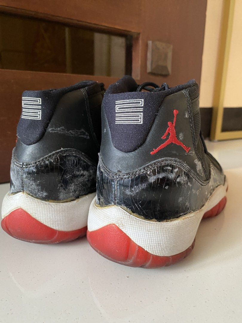 Air Jordan 11 Retro "Bred" (Category: Sneakers) located in Apalit. Submitted by dimenheats (Listing ID 1444647384, Image 3). Description: 24 cm US 5.5Y Original Not thrifted Pre-owned with visible signs of use MOD: J&t, Lalamove, or LBC.