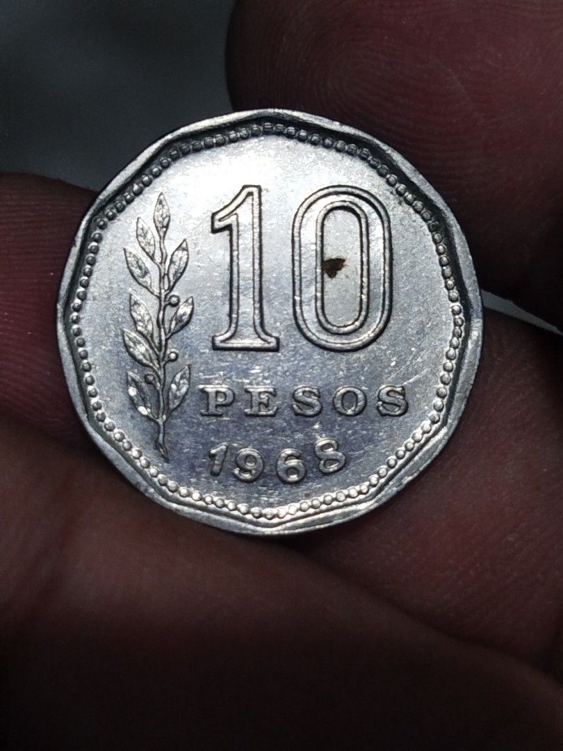 Argentina 10 Pesos Coin 1968 (Category: Currency) located in Subic. Submitted by regiedaniel01 (Listing ID 1444542255, Image 2). Description: - Vintage 1968 Argentina 10 Pesos coin - Features a rider on a horse design - Denomination and branch on the reverse side - Ideal for coin collectors or as a unique display piece.