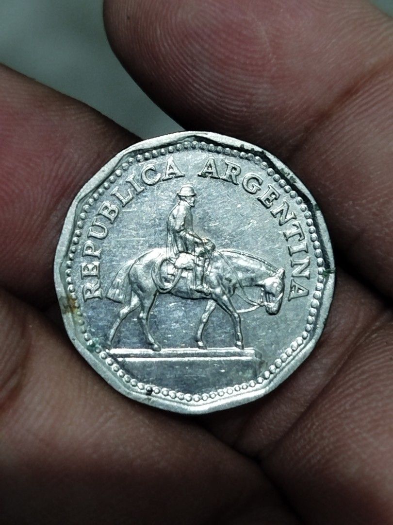 Argentina 10 Pesos Coin 1968 (Category: Currency) located in Subic. Submitted by regiedaniel01 (Listing ID 1444542255, Image 1). Description: - Vintage 1968 Argentina 10 Pesos coin - Features a rider on a horse design - Denomination and branch on the reverse side - Ideal for coin collectors or as a unique display piece.