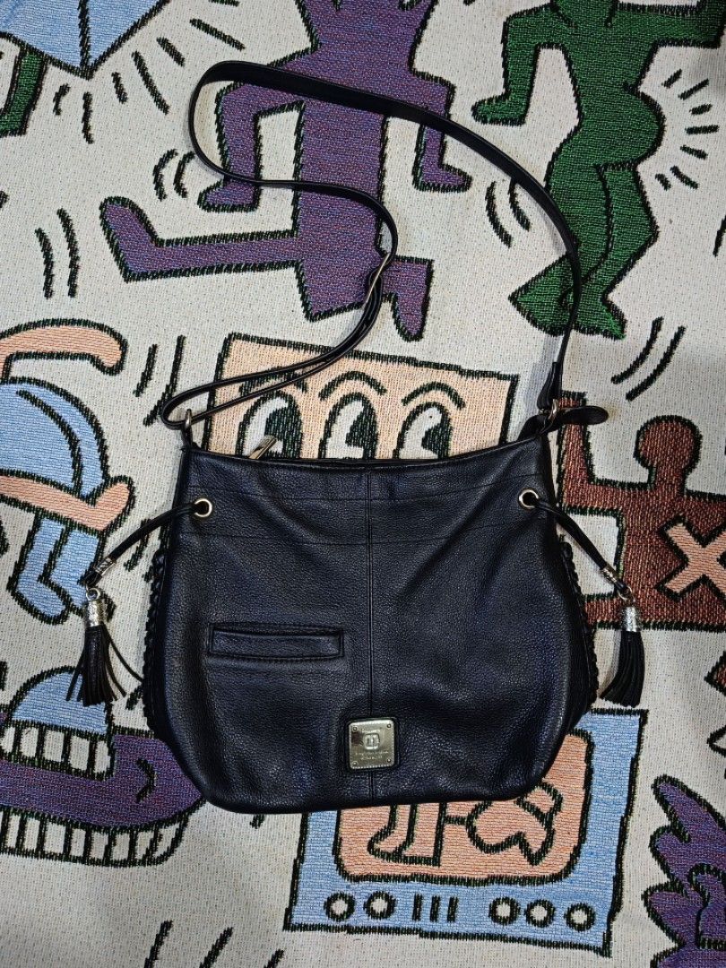 Authentic Nicole Miller Sling Bag (Category: Cross-body Bags) located in Taguig. Submitted by handpickedreplay (Listing ID 1444626060, Image 1). Description: Authentic Nicole Miller Sling Bag 👽 This is a guaranteed authentic nicole miller sling bag, coded as a proof of authenticity. The bag itself is made up of genuine leather as well as the tassel of the bag. This is excellent condition no major issue just minimal sign of usage, also the hardwa