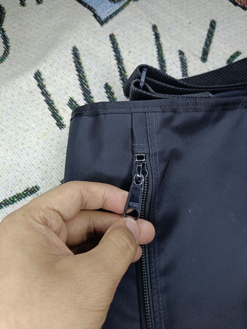 Authentic Renoma Messenger Bag (Category: Sling Bags) located in Taguig. Submitted by handpickedreplay (Listing ID 1444632382, Image 3). Description: Authentic Renoma Messenger Bag 👽 This is a renoma rare nylon messenger bag, it has multiple compartments and avail crow type closure. It has a missing clip pouch inside but you can use it as it is. It has a water resistant cover compartment. The bag still in excellent condition, colorate is 9.8/10 