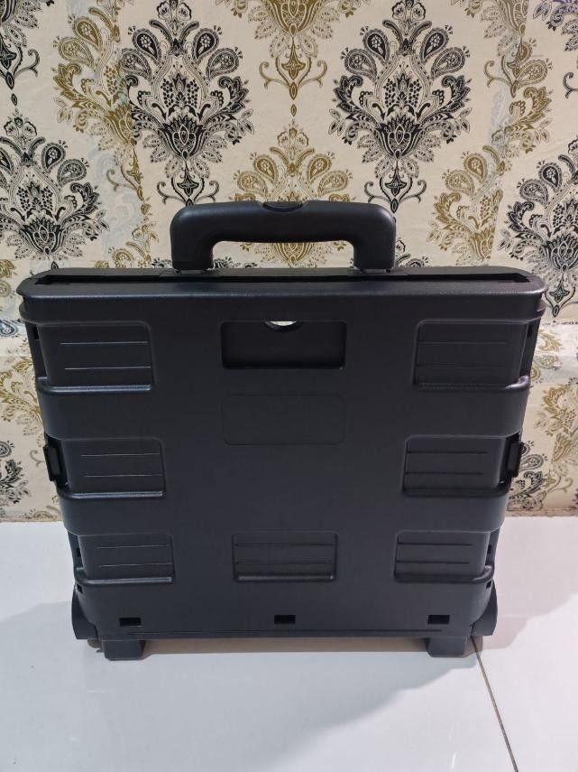 Black Folding Trolley Cart with Wheels and Handle (Category: Everything Else Others) located in Manila. Submitted by blake_05 (Listing ID 1444536920, Image 2). Description: - Black folding trolley cart - Features wheels and a retractable handle - Folds flat for convenient storage - Ideal for groceries, shopping, or moving items - Sturdy and portable design - Useful for both home and travel needs.