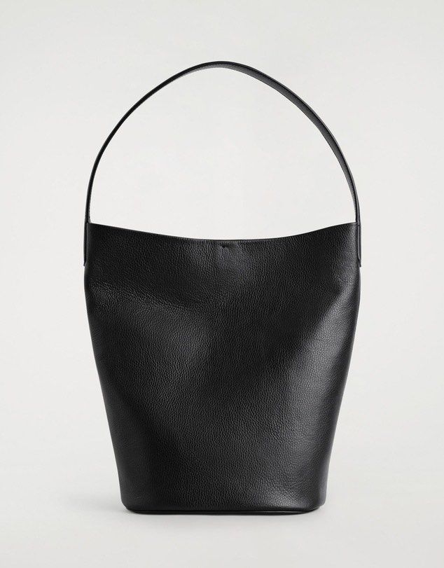 COS Authentic Black Leather Hobo Shoulder Bag (Category: Shoulder Bags) located in Taguig. Submitted by hellotheregirl (Listing ID 1444624250, Image 3). Description: - Classic black leather hobo bag - Authentic - Soft, pebbled Cowhide Leather texture - Simple, clean design with a single shoulder strap - Spacious interior, perfect for everyday essentials - Highly versatile, complements any outfit - Brand New Just stored.