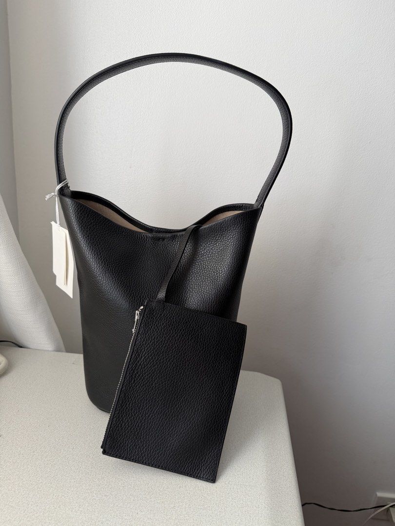 COS Authentic Black Leather Hobo Shoulder Bag (Category: Shoulder Bags) located in Taguig. Submitted by hellotheregirl (Listing ID 1444624250, Image 1). Description: - Classic black leather hobo bag - Authentic - Soft, pebbled Cowhide Leather texture - Simple, clean design with a single shoulder strap - Spacious interior, perfect for everyday essentials - Highly versatile, complements any outfit - Brand New Just stored.