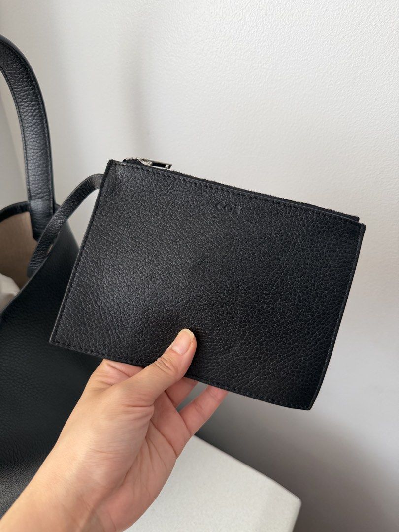 COS Authentic Black Leather Hobo Shoulder Bag (Category: Shoulder Bags) located in Taguig. Submitted by hellotheregirl (Listing ID 1444624250, Image 2). Description: - Classic black leather hobo bag - Authentic - Soft, pebbled Cowhide Leather texture - Simple, clean design with a single shoulder strap - Spacious interior, perfect for everyday essentials - Highly versatile, complements any outfit - Brand New Just stored.