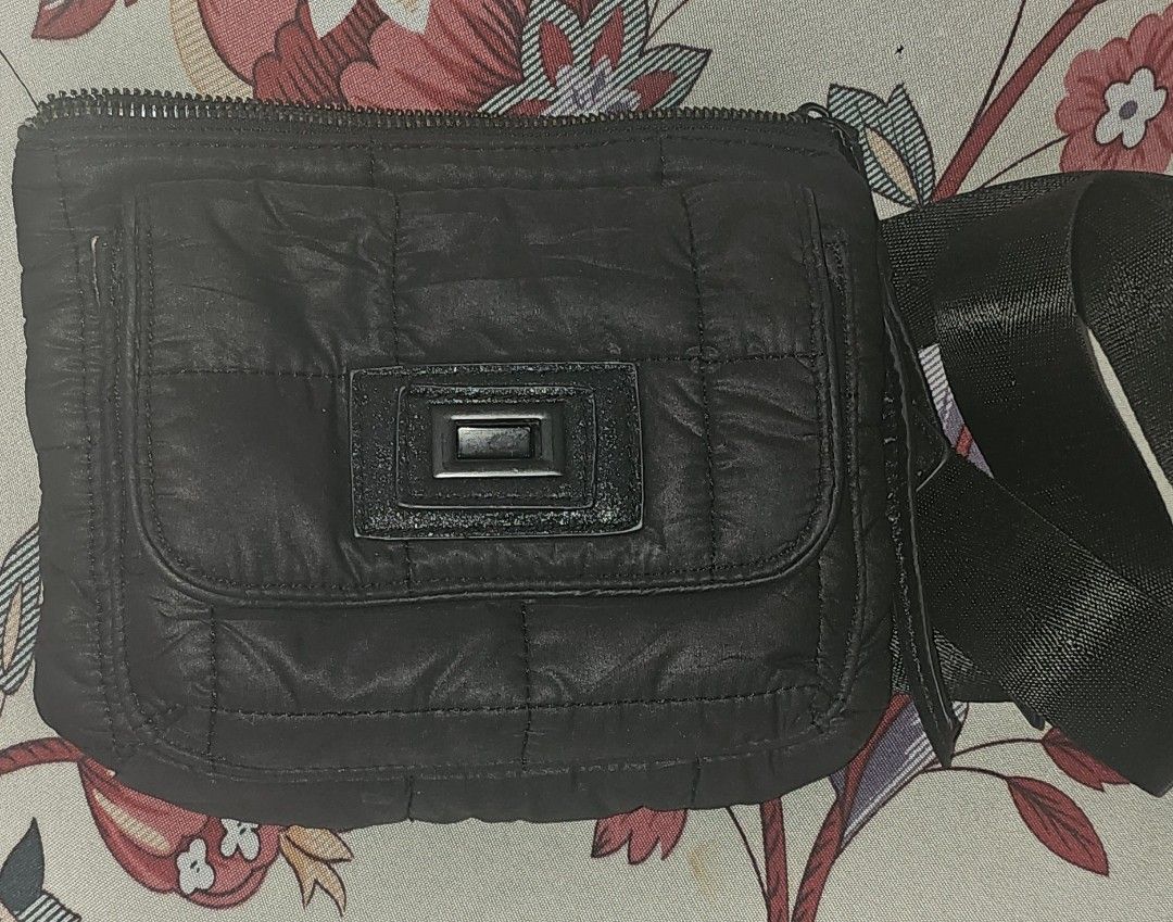 Black Quilted Crossbody Bag with Graphic Lining (Category: Cross-body Bags) located in Cainta. Submitted by cyjozuza (Listing ID 1444510819, Image 1). Description: - Stylish black quilted crossbody bag - Features a cool graphic print lining inside - Secure zipper closure - Adjustable strap for comfortable wear - Unique buckle detail on the front flap - Ideal for everyday use - Spacious enough for your essentials.